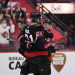 
              Ottawa Senators left wing Tim Stutzle (18) celebrates the goal of his teammate left wing Nick Paul (21) during the second period of an NHL hockey game against the Chicago Blackhawks Saturday, March 12, 2022 in Ottawa, Ontario.(Justin Tang/The Canadian Press via AP)
            