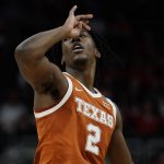 
              Texas's Marcus Carr reacts after a three-point basket during the first half of a second-round NCAA college basketball tournament game against Purdue Sunday, March 20, 2022, in Milwaukee. (AP Photo/Morry Gash)
            