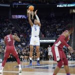 
              Duke forward Paolo Banchero (5) shoots a three point basket against Arkansas forward Trey Wade (3) during the first half of a college basketball game in the Elite 8 round of the NCAA men's tournament in San Francisco, Saturday, March 26, 2022. (AP Photo/Marcio Jose Sanchez)
            