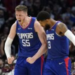 
              Los Angeles Clippers center Isaiah Hartenstein, left, celebrates with guard Paul George after they took the lead during the second half of an NBA basketball game Tuesday, March 29, 2022, in Los Angeles. (AP Photo/Mark J. Terrill)
            