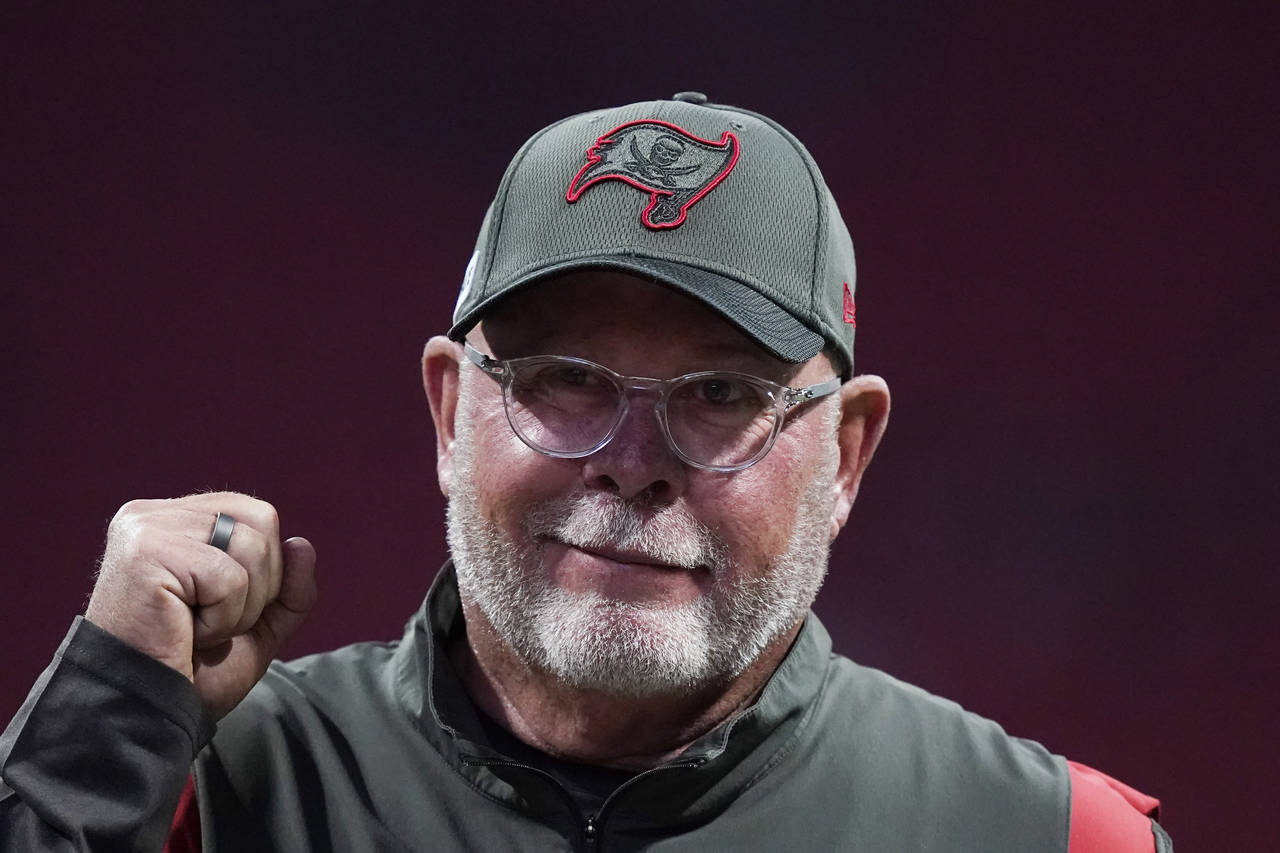 FILE - Tampa Bay Buccaneers coach Bruce Arians walks along the sideline before the team's NFL footb...