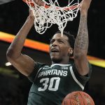 
              Michigan State's Marcus Bingham Jr. dunks during the second half of an NCAA college basketball game against Wisconsin at the Big Ten Conference tournament, Friday, March 11, 2022, in Indianapolis. (AP Photo/Darron Cummings)
            
