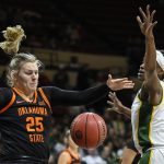 
              CORRECTS SCHOOL TO OKLAHOMA STATE INSTEAD OF OKLAHOMA - Oklahoma State forward Abbie Winchester (25) and Baylor center Queen Egbo (4) go after a rebound during the first half of an NCAA college basketball game in the Big 12 Conference tournament in Kansas City, Kan., Friday, March 11, 2022. (AP Photo/Reed Hoffmann)
            