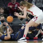 
              Utah's Kelsey Rees, right, falls into California's Jazlen Green (10) during the second half of an NCAA college basketball game in the first round of the Pac-12 women's tournament Wednesday, March 2, 2022, in Las Vegas. (AP Photo/John Locher)
            