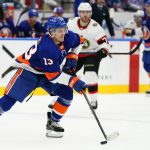 
              New York Islanders' Mathew Barzal (13) looks to pass the puck during the second period of the team's NHL hockey game against the Ottawa Senators on Tuesday, March 22, 2022, in Elmont, N.Y. (AP Photo/Frank Franklin II)
            