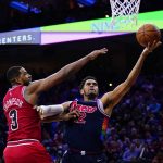 
              Philadelphia 76ers' Tobias Harris, right, goes up for a shot against Chicago Bulls' Tristan Thompson during the first half of an NBA basketball game, Monday, March 7, 2022, in Philadelphia. (AP Photo/Matt Slocum)
            