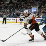 
              Anaheim Ducks center Ryan Getzlaf (15) moves the puck as San Jose Sharks right wing Timo Meier (28) defends during the second period of an NHL hockey game in San Jose, Calif., Saturday, March 26, 2022. (AP Photo/Josie Lepe)
            
