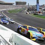 
              NASCAR Cup Series driver Kyle Busch (18) battels Joey Logano (22) as they go into Turn One during the NASCAR Cup Series auto race at Atlanta Motor Speedway in Hampton, Ga., Sunday, March 20, 2022. (AP Photo/John Bazemore)
            