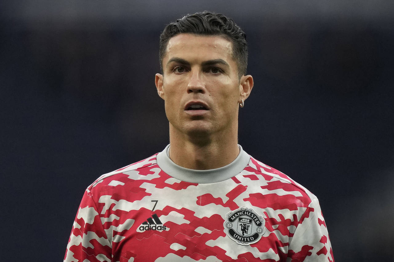 FILE - Manchester United's Cristiano Ronaldo warms up ahead of an English Premier League soccer mat...