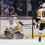 
              Pittsburgh Penguins goaltender Tristan Jarry (35) gives up a goal to New York Rangers left wing Chris Kreider (20) during the first period of an NHL hockey game, Friday, March 25, 2022, in New York. (AP Photo/John Minchillo)
            