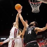 
              Washington State guard Tyrell Roberts (2) grabs a rebound over Santa Clara forward Keshawn Justice (14) during the second half of an NCAA college basketball game in the NIT on Tuesday, March 15, 2022, in Pullman, Wash. (Zach Wilkinson/Lewiston Tribune via AP)
            