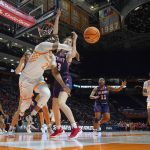 
              Tennessee's Alexus Dye (2) passes the ball away from Belmont's Nikki Baird (23) in the second half of a women's college basketball game in the second round of the NCAA tournament Monday, March 21, 2022, in Knoxville, Tenn. (AP Photo/Mark Humphrey)
            