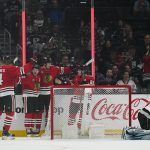 
              The Chicago Blackhawks celebrate after left wing Alex DeBrincat (12) scored during the second period of an NHL hockey game Los Angeles Kings Thursday, March 24, 2022, in Los Angeles. Los Angeles Kings goaltender Jonathan Quick (32) reacts. (AP Photo/Ashley Landis)
            