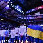 
              Creighton's Rati Andronikashvili, right, and Modestas Kancleris second from right, wear a flag of Ukraine before an NCAA college basketball game against Villanova in the final of the Big East conference tournament Saturday, March 12, 2022, in New York. (AP Photo/Frank Franklin II)
            