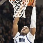 
              Villanova forward Eric Dixon (43) dunks during the second half of an NCAA college basketball game against Providence, Tuesday, March 1, 2022, in Villanova, Pa. (AP Photo/Laurence Kesterson)
            