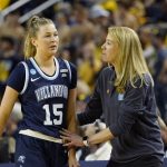 
              Villanova head coach Denise Dillon talks with guard Brooke Mullin (15) during the second half of a college basketball game in the second round of the NCAA tournament against Michigan, Monday, March 21, 2022, in Ann Arbor, Mich. (AP Photo/Carlos Osorio)
            