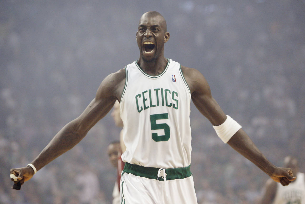 FILE - Boston Celtics' Kevin Garnett gestures to the crowd just before tipoff of Game 1 of an NBA E...