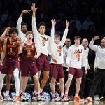 
              The Virginia Tech bench reacts after Keve Aluma scores in the second half of an NCAA college basketball game against Notre Dame during quarterfinals of the Atlantic Coast Conference men's tournament, Thursday, March 10, 2022, in New York. (AP Photo/John Minchillo)
            