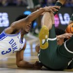 
              Duke guard Jeremy Roach vies for the ball with Michigan State forward Malik Hall during the first half of a college basketball game in the second round of the NCAA tournament on Sunday, March 20, 2022, in Greenville, S.C. (AP Photo/Chris Carlson)
            