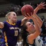 
              Maine's Caroline Bornemann, right, is defended by Albany's Ellen Hahne during the first half half of an NCAA college basketball game in the championship of the the America East Conference tournament, Friday, March 11, 2022, at Orono, Maine. (AP Photo/Robert F. Bukaty)
            