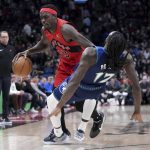 
              Toronto Raptors forward Pascal Siakam (43) runs into Minnesota Timberwolves forward Taurean Prince (12), sending him to the floor during the first half of an NBA basketball game Wednesday, March 30, 2022, in Toronto. (Nathan Denette/The Canadian Press via AP)
            