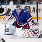 
              New York Rangers goaltender Igor Shesterkin (31) watches the puck after making a save against the Pittsburgh Penguins during the first period of an NHL hockey game, Friday, March 25, 2022, in New York. (AP Photo/John Minchillo)
            