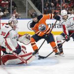 
              Washington Capitals' Trevor van Riemsdyk (57) looks for the puck in front of Edmonton Oilers' Kailer Yamamoto (56) and goalie Ilya Samsonov (30) during the second period of an NHL hockey game Wednesday, March 9, 2022 in Edmonton, Alberta.(Amber Bracken/The Canadian Press via AP)
            