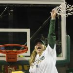 
              Celebrating the Big 12 regular season champion title, Baylor head coach Nicki Collen waves the cut net after an NCAA college basketball game against Texas Tech in Waco, Texas, Sunday, March 6, 2022. (AP Photo/LM Otero)
            