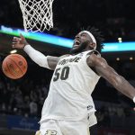 
              Purdue's Trevion Williams (50) loses control of the ball as he goes up for a dunk during the second half of an NCAA college basketball game against Penn State at the Big Ten Conference tournament, Friday, March 11, 2022, in Indianapolis. (AP Photo/Darron Cummings)
            