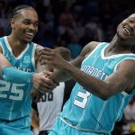 
              Charlotte Hornets guard Terry Rozier and forward P.J. Washington, left, celebrate during the second half of an NBA basketball game against the San Antonio Spurs on Saturday, March 5, 2022, in Charlotte, N.C. (AP Photo/Chris Carlson)
            
