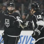 
              Los Angeles Kings center Phillip Danault (24) celebrates with center Trevor Moore (12) after scoring during the first period of an NHL hockey game against the San Jose Sharks Thursday, March 10, 2022, in Los Angeles. (AP Photo/Ashley Landis)
            