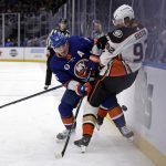
              New York Islanders right wing Cal Clutterbuck (15) battles for the puck with Anaheim Ducks defenseman Andrej Sustr in the first period of an NHL hockey game, Sunday, March 13, 2022, in Elmont, N.Y. (AP Photo/Adam Hunger)
            