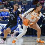 
              Kentucky's Jada Walker (11) knocks the ball away from Tennessee's Rae Burrell (12) in the first half of an NCAA college basketball semifinal round game at the women's Southeastern Conference tournament Saturday, March 5, 2022, in Nashville, Tenn. (AP Photo/Mark Humphrey)
            