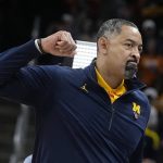 
              Michigan head coach Juwan Howard reacts after his team defeated Tennessee in a college basketball game in the second round of the NCAA tournament, Saturday, March 19, 2022, in Indianapolis. (AP Photo/Darron Cummings)
            