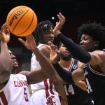 
              Washington State guard TJ Bamba (5) vies for the ball against Santa Clara guard Jalen Williams (24) during the second half of an NCAA college basketball game in the NIT on Tuesday, March 15, 2022, in Pullman, Wash. (Zach Wilkinson/Lewiston Tribune via AP)
            