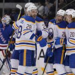 
              Buffalo Sabres' Kyle Okposo, second from right, celebrates his goal with teammates during the second period of the NHL hockey game against the New York Rangers, Sunday, March 27, 2022, in New York. (AP Photo/Seth Wenig)
            