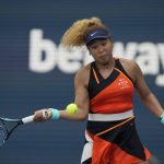 
              Naomi Osaka of Japan plays a ball in her women's semifinal match against Belinda Bencic of Switzerland, at the Miami Open tennis tournament, Thursday, March 31, 2022, in Miami Gardens, Fla. (AP Photo/Rebecca Blackwell)
            