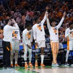 
              Tennessee players celebrate on the bench during the first half of a college basketball game against Longwood in the first round of the NCAA tournament in Indianapolis, Thursday, March 17, 2022. (AP Photo/Michael Conroy)
            