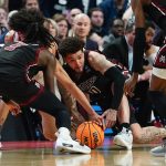 
              New Mexico State guard Teddy Allen (0) steals the ball from Connecticut guard Andre Jackson, back left, late in the second half of a college basketball game in the first round of the NCAA men's tournament Thursday, March 17, 2022, in Buffalo, N.Y. (AP Photo/Frank Franklin II)
            