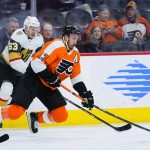 
              Philadelphia Flyers' Kevin Hayes, right, and Vegas Golden Knights' Evgenii Dadonov battle for the puck during the second period of an NHL hockey game, Tuesday, March 8, 2022, in Philadelphia. (AP Photo/Matt Slocum)
            
