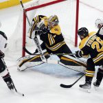 
              Boston Bruins' Jeremy Swayman (1) blocks a shot by Arizona Coyotes' Phil Kessel (81) during the first period of an NHL hockey game, Saturday, March 12, 2022, in Boston. (AP Photo/Michael Dwyer)
            