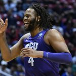
              TCU center Eddie Lampkin (4) reacts after a first-round NCAA college basketball tournament game against Seton Hall, Friday, March 18, 2022, in San Diego. (AP Photo/Denis Poroy)
            