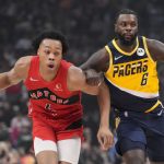 
              Toronto Raptors forward Scottie Barnes (4) moves up court as Indiana Pacers guard Lance Stephenson (6) defends during the first half of an NBA basketball game Saturday, March 26, 2022, in Toronto. (Frank Gunn/The Canadian Press via AP)
            