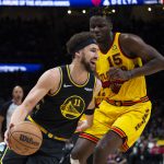 
              Golden State Warriors guard Klay Thompson (11) drives past Atlanta Hawks center Clint Capela (15) during the second half of an NBA basketball game Friday, March 25, 2022, in Atlanta. (AP Photo/Hakim Wright Sr.)
            