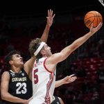 
              Utah guard Jaxon Brenchley (5) goes to the basket as Colorado forward Tristan da Silva (23) defends during the second half of an NCAA college basketball game Saturday, March 5, 2022, in Salt Lake City. (AP Photo/Rick Bowmer)
            