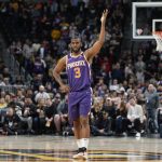 
              Phoenix Suns guard Chris Paul gestures to the crowd at the end of the team's NBA basketball game against the Denver Nuggets on Thursday, March 24, 2022, in Denver. (AP Photo/David Zalubowski)
            
