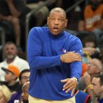 
              Philadelphia 76ers head coach Doc Rivers reacts to a foul call during the first half of an NBA basketball game against the Phoenix Suns, Sunday, March 27, 2022, in Phoenix. (AP Photo/Rick Scuteri)
            