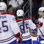 
              Montreal Canadiens right wing Josh Anderson (17) is celebrates with teammates after scoring a goal during the second period of an NHL hockey game against the New Jersey Devils on Sunday, March 27, 2022, in Newark, N.J. (AP Photo/Adam Hunger)
            