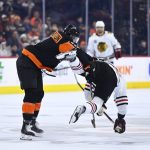 
              Philadelphia Flyers' Kevin Connauton, left, checks Chicago Blackhawks' Patrick Kane during the third period of an NHL hockey game, Saturday, March 5, 2022, in Philadelphia. (AP Photo/Derik Hamilton)
            