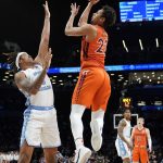 
              Virginia Tech's Keve Aluma (22) shoots against North Carolina's Armando Bacot (5) in the first half of an NCAA college basketball game during semifinals of the Atlantic Coast Conference men's tournament, Friday, March 11, 2022, in New York. (AP Photo/John Minchillo)
            